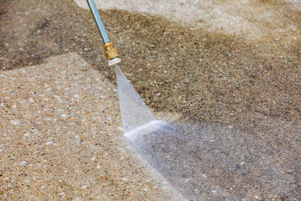 Pressure Washing Concrete Driveway. Home Cleaning, Maintenance A